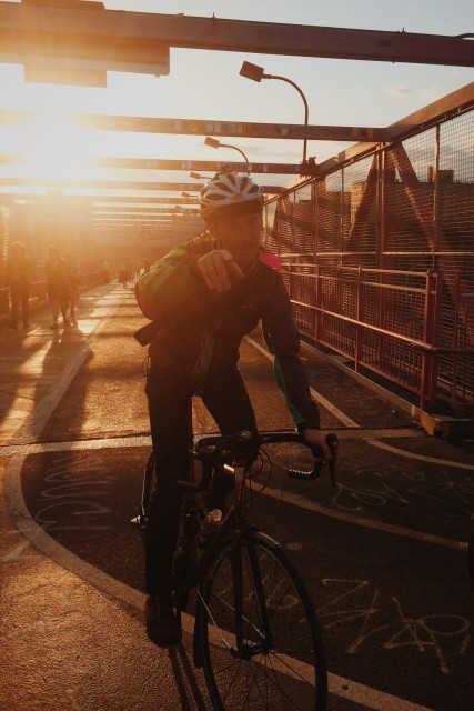 On the Williamsburg Bridge on the evening following the 2015 TD Five Boro Bike Tour. It'd be better if he was riding into the sunset, but it'll do.  