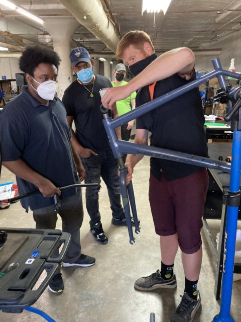 Participants in Bike Path learn to repair Citibikes