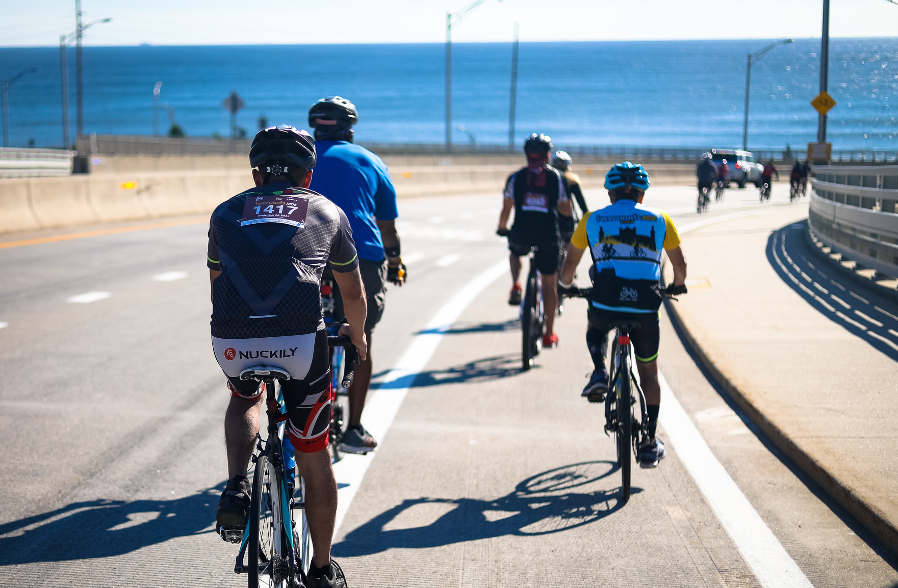Riders approach the Jersey coast on the Twin Lights Ride